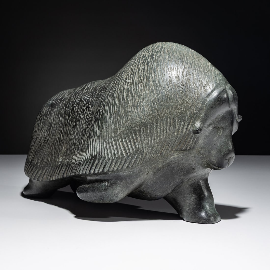 Barnabus Arnasungaaq (Inuit [Qamani'tuaq], 1924-2017) Muskox, Exhibited, 1968: Barnabus Arnasungaaq (Inuit [Qamani'tuaq], 1924-2017) Muskox, Exhibited, 1968 stone unsigned height 8-3/4 inches x length 14 inches Exhibited: July 20 - October 19, 1986 The John and Mary