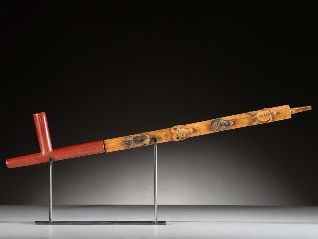 Standing Rock Figural Pipe with Catlinite Bowl: Standing Rock Figural Pipe with Catlinite Bowl lightly pigmented stem carved with a turtle, buffalo, sheep, and beaver; T-shaped catlinite bowl overall length 29-1/2 inches; bowl length 9 inches x hei