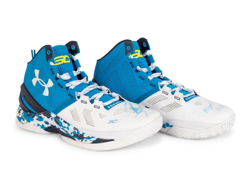 A Pair of Stephen Curry Signed Autograph Under Armour Basketball Shoes (Fanatics Authentic): A Pair of Stephen Curry Signed Autograph Under Armour Basketball Shoes (Fanatics Authentic) Inscribed "Steph Curry NBA MVP" in blue. This lot is located in Chicago. 
