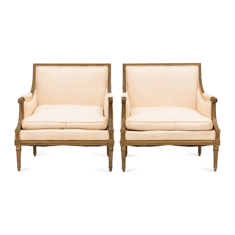 A Pair of Louis XVI Style Gilt Walnut and Upholstered Bergères: A Pair of Louis XVI Style Gilt Walnut and Upholstered Bergères Early 19th Century Height 36 x width 34 1/4 inches. This lot is located in Palm Beach.