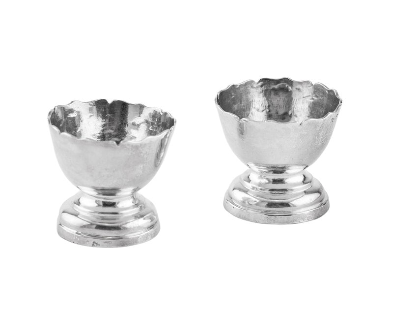 A Pair of Continental Silver Master Salts: A Pair of Continental Silver Master Salts 18th Century Height 1/2 x diameter 1 inch. 1 Ozt 18 Dwt Property from a Private Collection This lot is located in Chicago. 