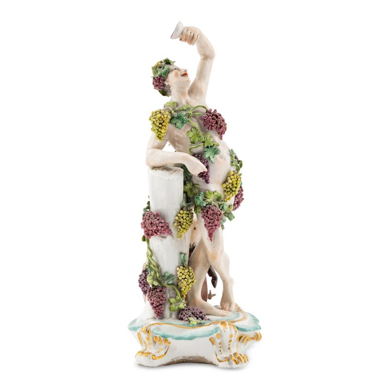 A French Porcelain Bacchanal Figure: A French Porcelain Bacchanal Figure Late 19th Century Height 10 3/4 x width 5 1/2 x depth 5 1/2 inches. This lot is located in Chicago. 
