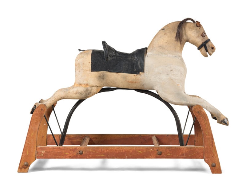 A Polychrome Painted Carousel Horse: A Polychrome Painted Carousel Horse Early 20th Century Horse height 22 x width 44 inches. This lot is located in Chicago. 