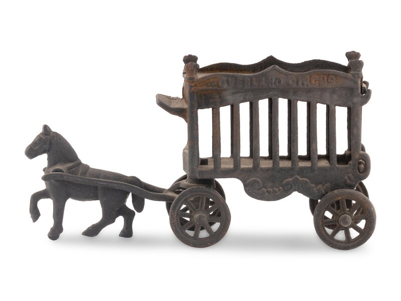 A Cast Iron Horse-Led Wagon Train Pull Toy: A Cast Iron Horse-Led Wagon Train Pull Toy Late 19th century Height 2 x length 4 inches. Estate of the artist Philip Pearlstein (1924-2022), New York This lot