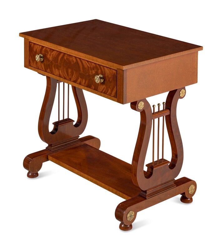 A Regency Style Mahogany Lyre-Base Side Table: A Regency Style Mahogany Lyre-Base Side Table Kindel, 20th Century Height 27 x width 28 x depth 18 1/2 inches. This lot is located in Chicago.