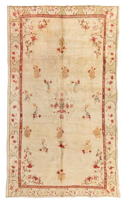 An Oushak Rug : An Oushak Rug West Anatolia, Circa 1900 10 feet 4 inches x 5 feet 11 inches. Property from a Private Family Trust This lot is located in Chicago.