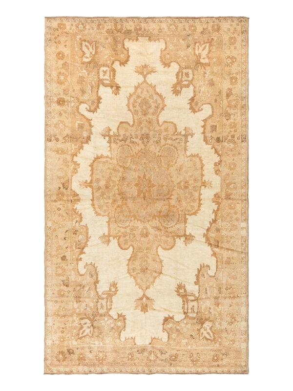 An Oushak Rug: An Oushak Rug West Anatolia, Late 19th Century 12 feet x 6 feet 6 inches. Property from a Private Family Trust This lot is located in Chicago. ConditionChemically washed to neutralize the original