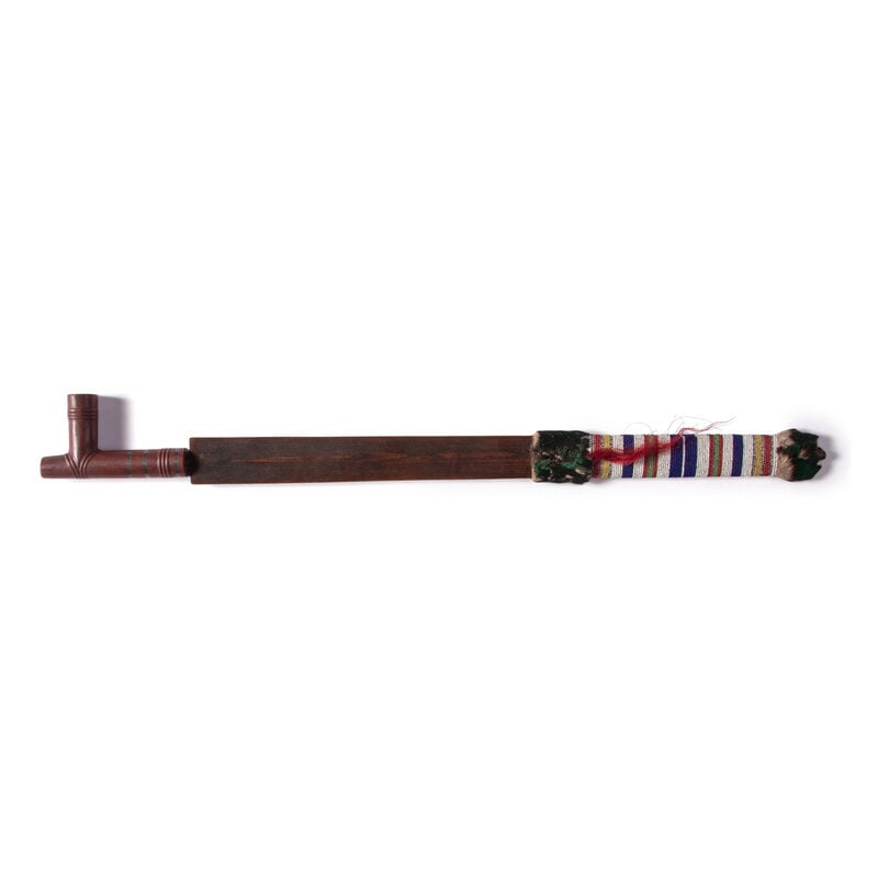 Plains Beaded Pipe Stem, with Catlinite Bowl: Plains Beaded Pipe Stem, with Catlinite Bowl early 20th century flat stem wrapped with white, dark blue, red white-heart, greasy yellow, and green beads; T-shaped catlinite bowl carved with rings