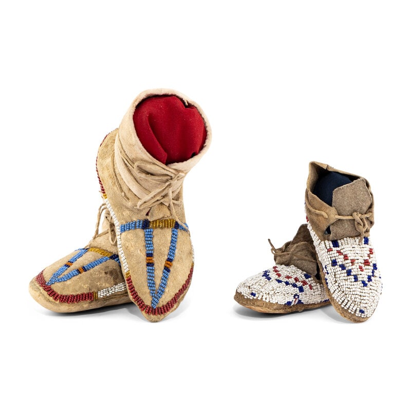 Cheyenne Child's Beaded Hide Moccasins: Cheyenne Child's Beaded Hide Moccasins fourth quarter 19th century lot of 2, includes: a pair, sinew-sewn and beaded on the vamps and sides; length 4-1/2 inches a pair, sinew-sewn with beaded lanes