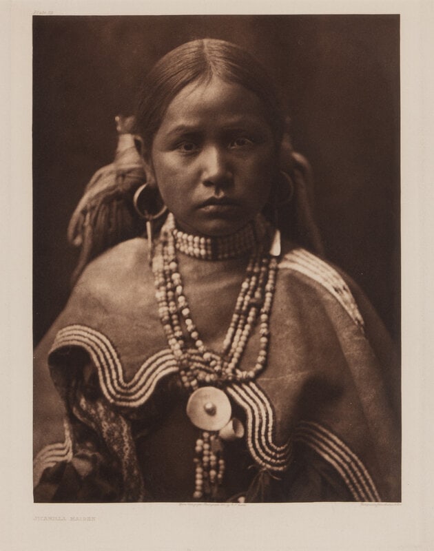 Edward S. Curtis (American, 1868-1952) Jicarilla Maiden, Plate 22: Edward S. Curtis(American, 1868-1952)Jicarilla Maiden, Plate 22photogravure 1904, from a copyright photograph by E.S. Curtis. Printed by John Andrew & Son. (sight) 17-3/4 x 12-7/8 inches; (frame)