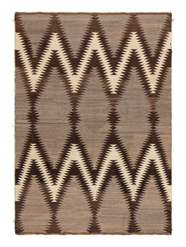 Navajo Regional Weaving [Rug]: Navajo Regional Weaving [Rug] first quarter 20th century handspun wool of natural colors designed with a bold zigzagging pattern71 x 51-1/2 inches This