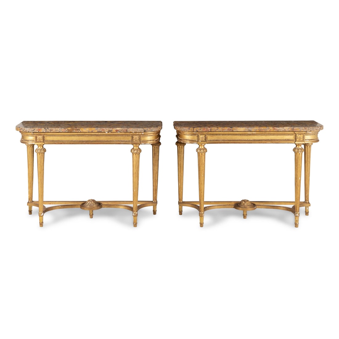 A Pair of Louis XVI Style Giltwood and Marble-Top Console Tables: A Pair of Louis XVI Style Giltwood and Marble-Top Console Tables By Maison Carlhian, Paris, Early 20th Century both examples stamped 'Carlhian Made in France'. Height 35 x width 51 x depth 18 1/2 inch