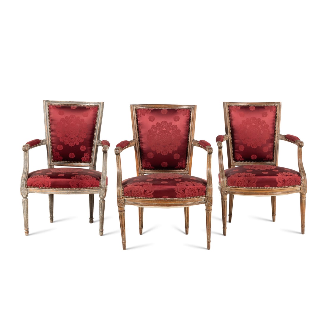 A Matched Set of Three Louis XVI Fauteuils: A Matched Set of Three Louis XVI Fauteuils Late 18th Century comprising one pair and one similarly carved and grey-painted example, this example stamped indistinctly on the front rail. Height 34x widt