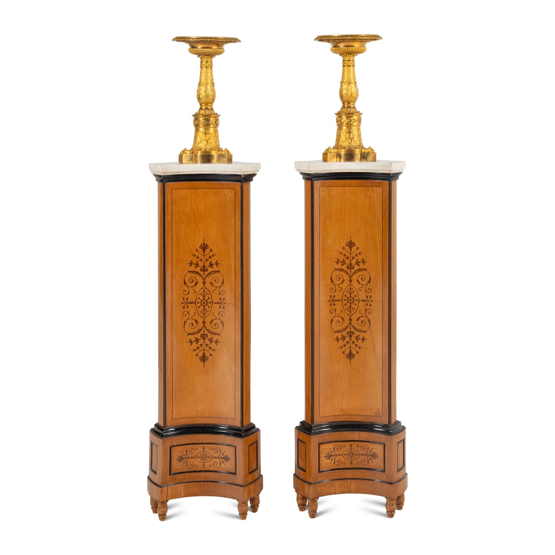 A Pair of Late Empire Gilt Bronze Tazze: A Pair of Late Empire Gilt Bronze Tazze By Pierre-Philippe Thomire, Circa 1815 signed 'THOMIRE A PARIS' on the base; on later Charles X marquetry pedestals. Height of tazze 15 3/4 x diameter 8 1/2 inc
