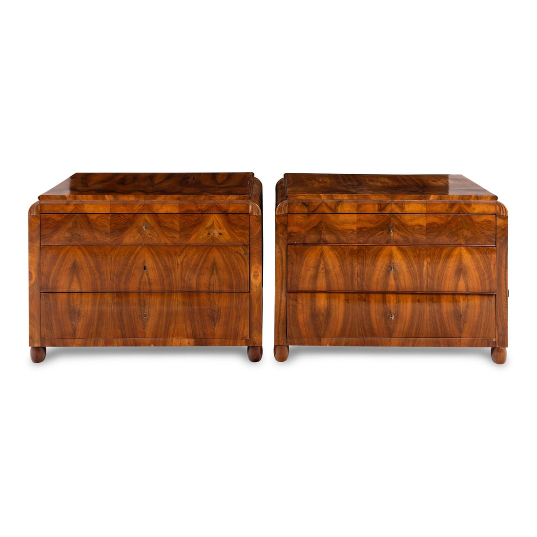 A Pair of Austrian Walnut Commodes: A Pair of Austrian Walnut Commodes Vienna, Circa 1830-40 each with a glass top. Height 34 1/2 x width 47 x depth 24 inches. This lot is located in Chicago.
