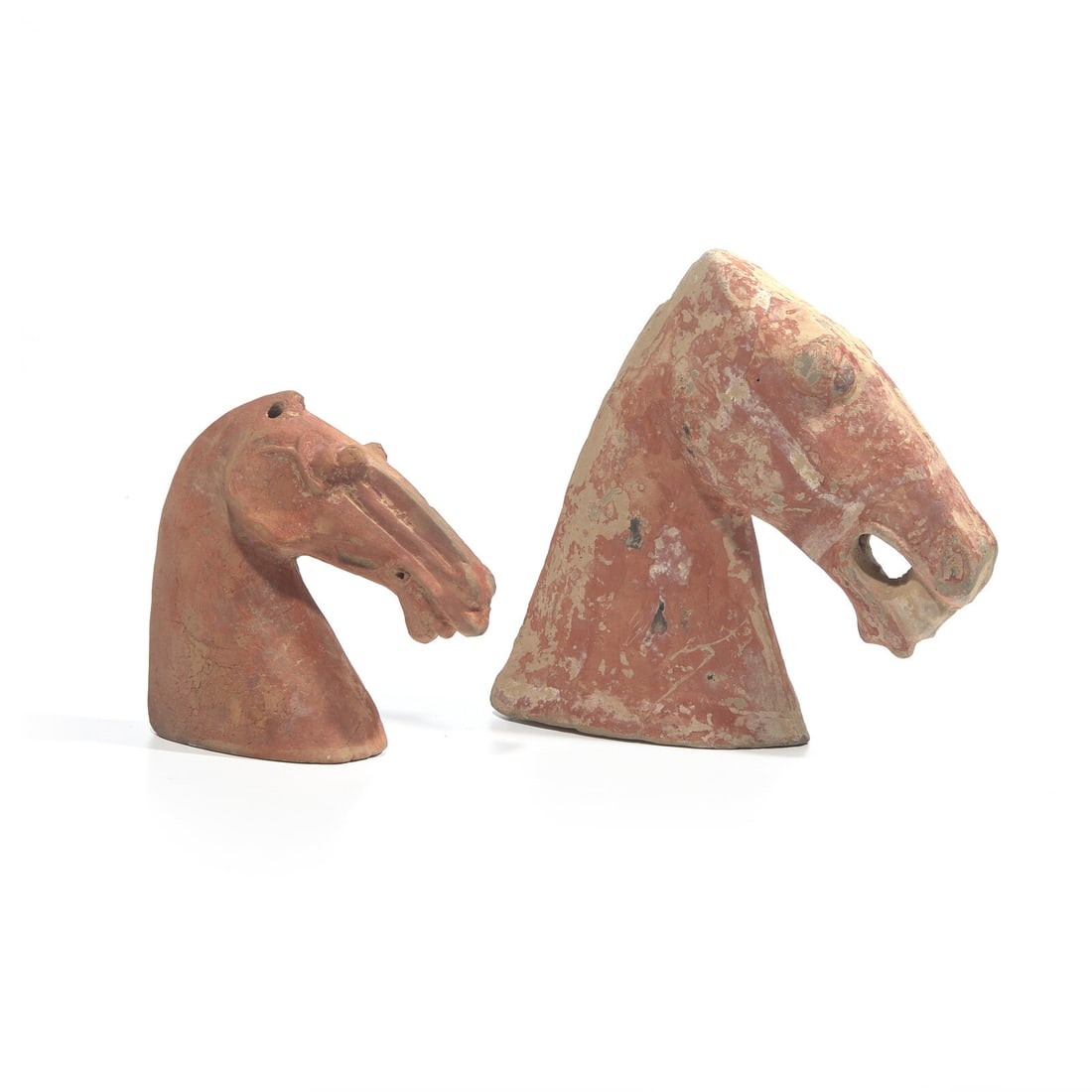 Two Chinese Painted Pottery Heads of Horses, Han Dynasty 漢 紅陶馬頭: Two Chinese Painted Pottery Heads of Horses, Han Dynasty 漢 紅陶馬頭兩件 Han Dynasty (206 B.C. - 220 A.D.) Height of smaller 9 x length 8 in., 22.9 x 20.3 cm.
