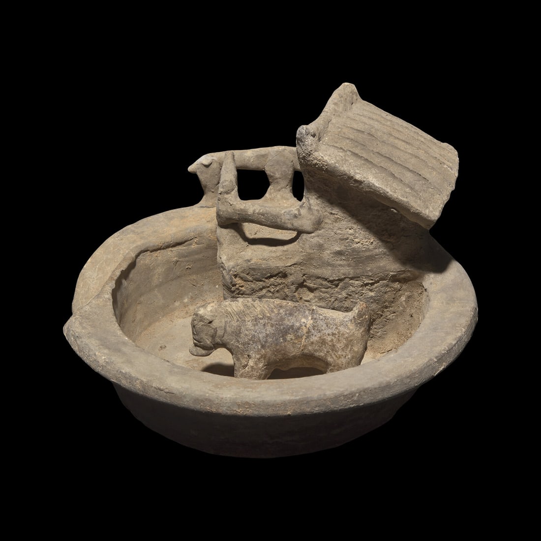 A Chinese Grey Pottery Model of a Pigsty with Occupant, Han Dynasty 漢 陶豬圈: A Chinese Grey Pottery Model of a Pigsty with Occupant, Han Dynasty 漢 陶豬圈 Han Dynasty (206 B.C. - 220 A.D.) The pigsty model has a small indoor space, with a separate potte