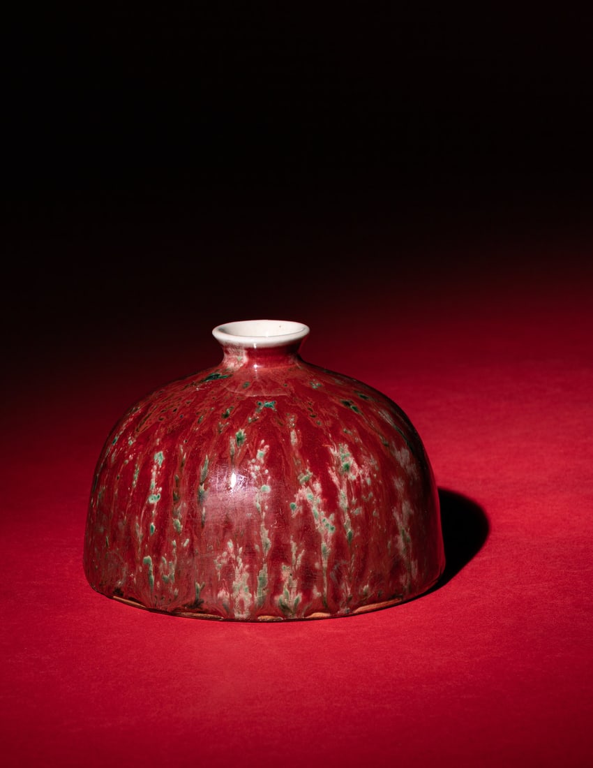 A Peachbloom Glazed Porcelain Waterpot, Taibaizun, 19th Century 清晚期 豇: A Peachbloom Glazed Porcelain Waterpot, Taibaizun, 19th Century 清晚期 豇豆紅釉太白尊 19TH CENTURY The domed walls rounded to a short neck a