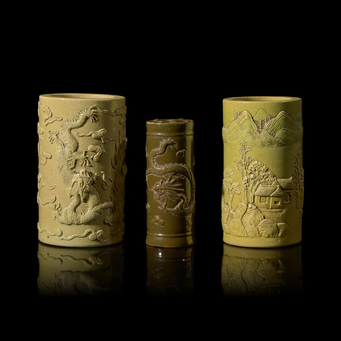 A Chinese Teadust Glazed Porcelain Joss-Stick Holder and Two Yellow Glazed Porcelain Brushpots, (1 of 3)
