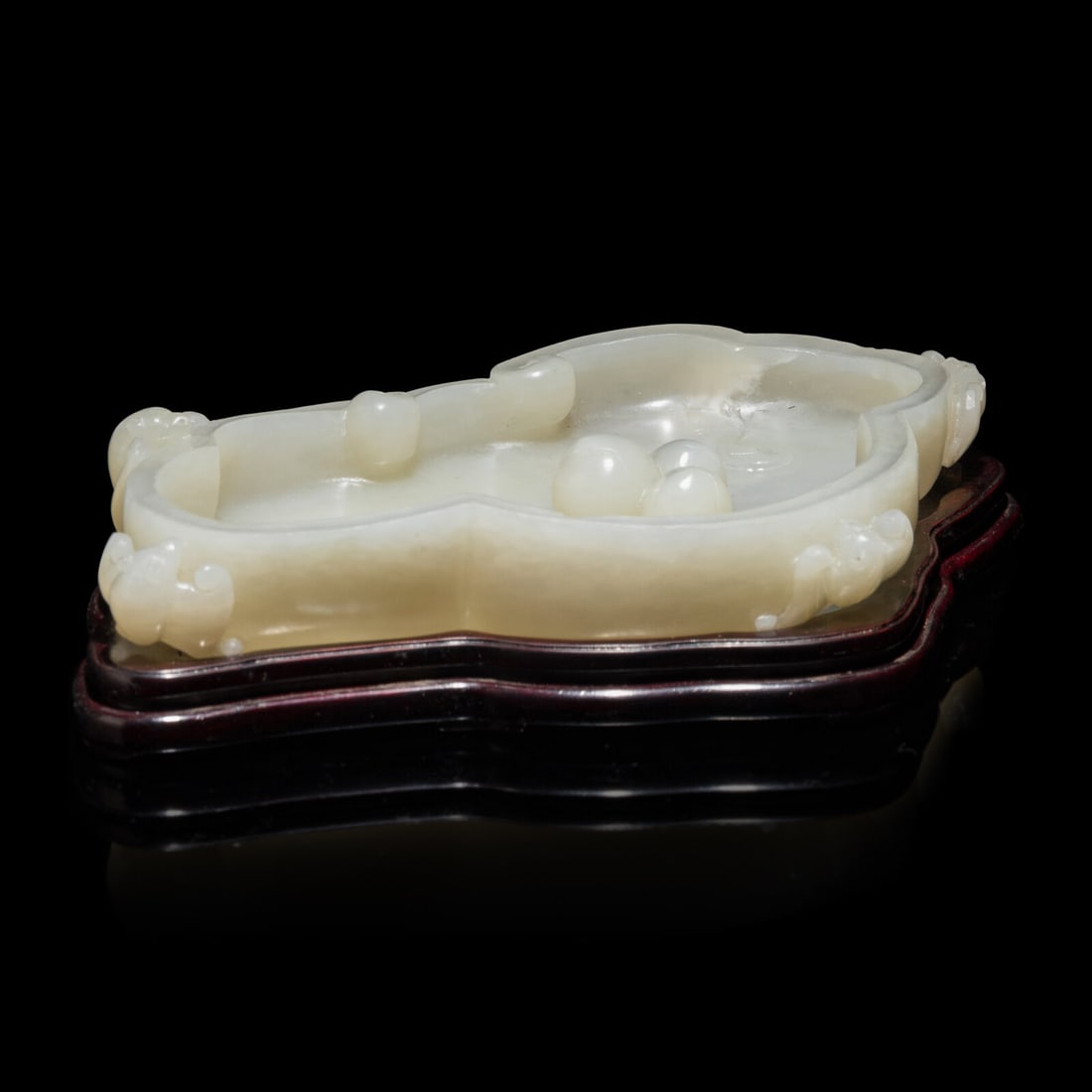 A Chinese White Jade 'Peach and Bat' Washer 白玉云蝠壽桃紋: A Chinese White Jade 'Peach and Bat' Washer 白玉云蝠壽桃紋筆洗 With wood stand. Length 6 1/2 in., 16.5 cm. Property from a Georgia Collector. This