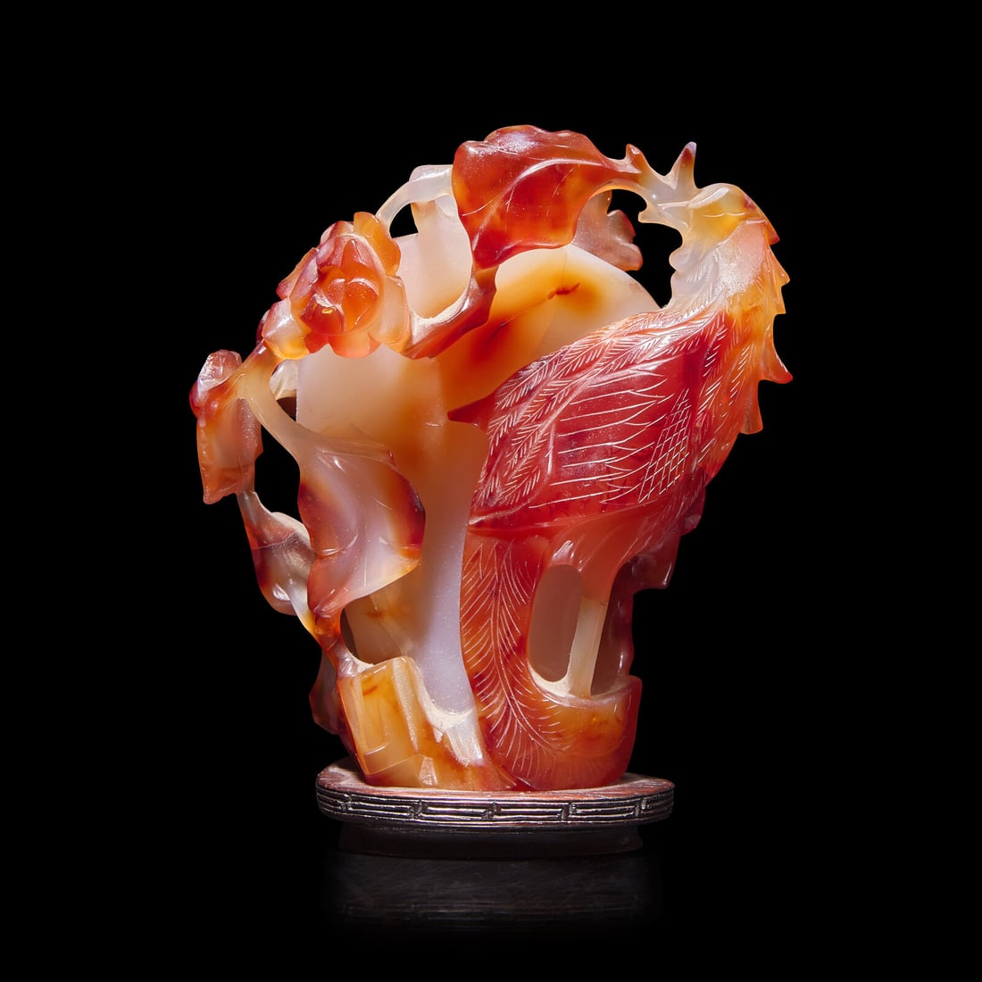 A Chinese Agate Vase, 20th Century 近代 俏雕瑪瑙花插: A Chinese Agate Vase, 20th Century 近代 俏雕瑪瑙花插 Carved with a phoenix and flowers, with a wood stand. Height with stand 5 1/8 in., 13 cm. This lot