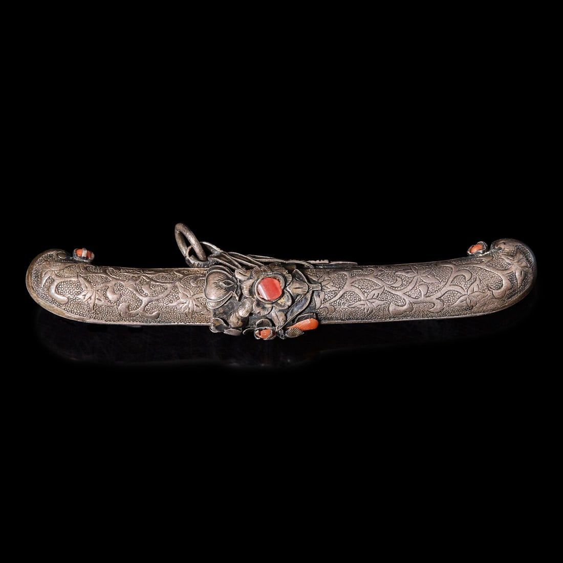 A Small Korean Knife: A Small Korean Knife The handle and scabbard feature chased and repoussé decoration and are adorned with red gemstones. Length with scabbard 4 3/8 in., 11.2 cm. Property from a Distinguished Priv
