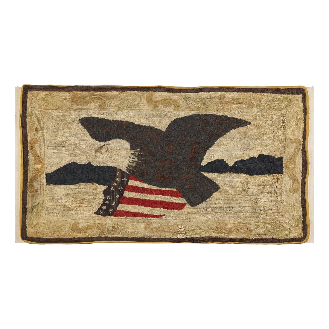 A Hooked Rug Depicting an American Eagle and Patriotic Shield: A Hooked Rug Depicting an American Eagle and Patriotic Shield Late 19th / Early 20th Century mounted on a stretched canvas for hanging. 26 1/4 x 48 inches (rug only). Estate of Vincent M. McGrath, Mar