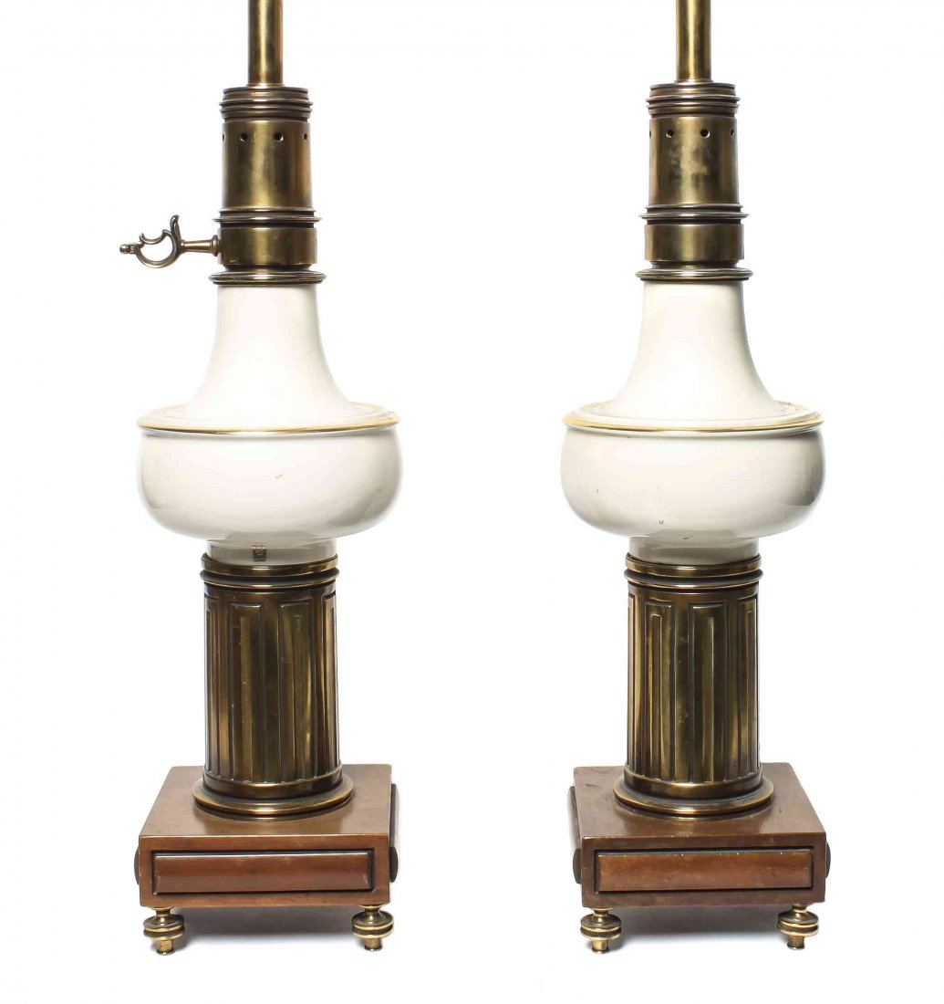 A Pair of Porcelain and Brass Table Lamps, Height 21 in: A Pair of Porcelain and Brass Table Lamps, Lennox, circa 1960, having a shaped porcelain bowl set upon a reeded brass column terminating in a square wood base on turned brass feet. Height 21 inches.