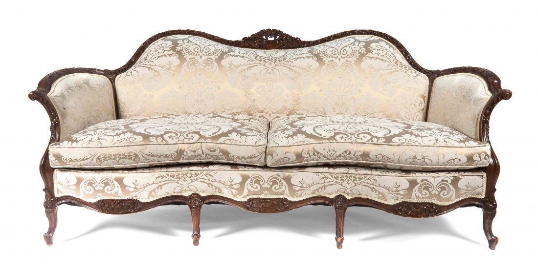 A Rococo Revival Style Carved Mahogany Settee, Height 3: A Rococo Revival Style Carved Mahogany Settee, the carved foliate crest above the upholstered back and seat, raised on cabriole legs. Height 35 1/2 x width 77 x depth 23 1/2 inches.