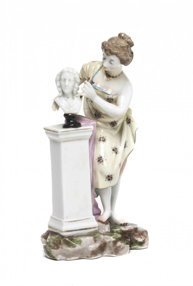 A Meissen Porcelain Figurine, Height 5 1/2 inches.: A Meissen Porcelain Figurine, depicting a female figure sculpting a marble bust, having crossed swords mark in underglaze blue. Height 5 1/2 inches. Property from the Collection of Charles Scofield, E