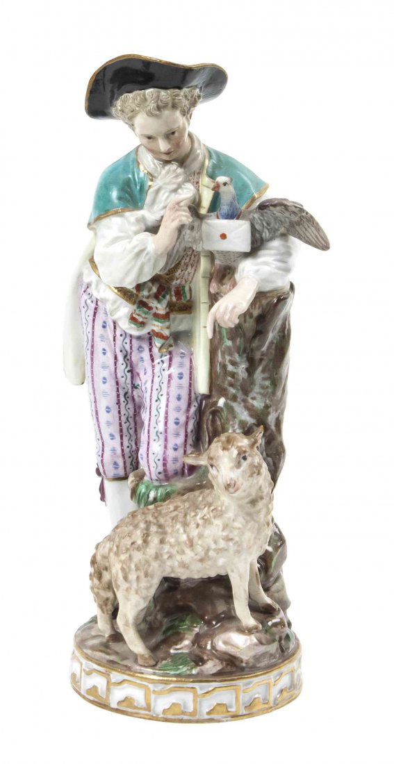 A Meissen Porcelain Figural Group, Height 7 1/2 inches.: A Meissen Porcelain Figural Group, depicting a boy in 18th century attire posed with a lamb, raised on a naturalistic base, having crossed sword marks in blue underglaze. Height 7 1/2 inches. Property