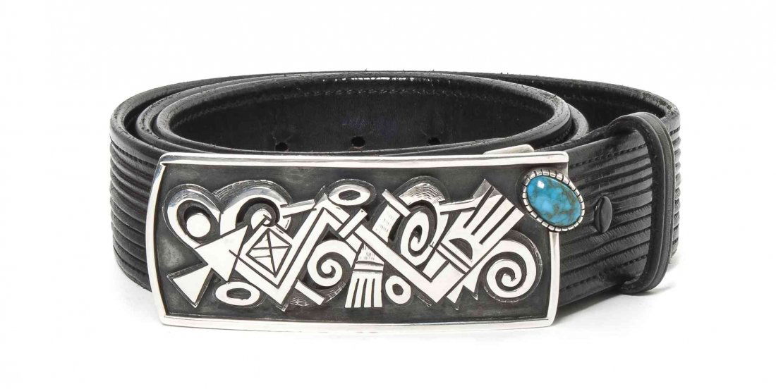 A Hopi Sterling Silver and Turquoise Overlay Belt Buckl: A Hopi Sterling Silver and Turquoise Overlay Belt Buckle, Lomawywesa, Michael Kabotie, having overlay modernist design with an edge mounted bisbee turquoise cabochon set in a serrated bezel, signed Lo