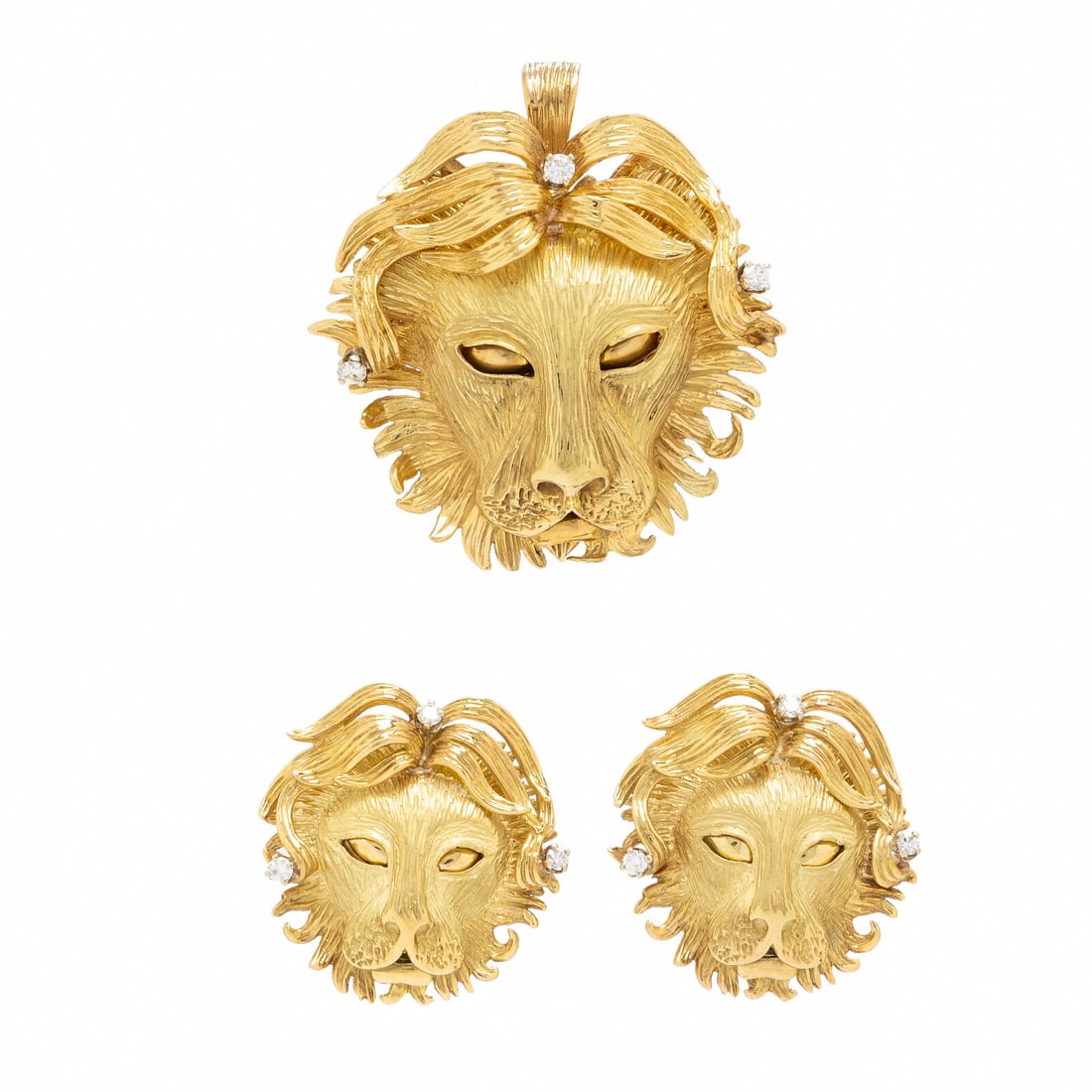 Yellow Gold and Diamond Lion Brooch and Earrings: Yellow Gold and Diamond Lion Brooch and Earrings Including a pendant brooch and a pair of earrings, each set with round diamonds. 18 karat yellow gold. Brooch: 1 7/8 x 1 3/4 inches. Earrings: 1 1/8