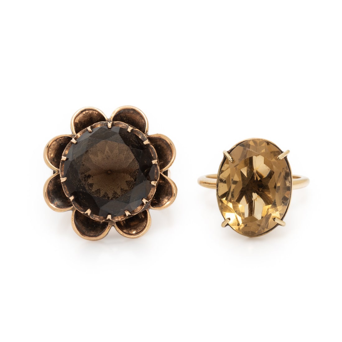 Collection of Multigem Rings: Collection of Multigem Rings Including two rings, one set with an oval citrine and the other set with a round smoky quartz. Low karat yellow gold and 14 karat yellow gold. Ring size 7, ring size 5