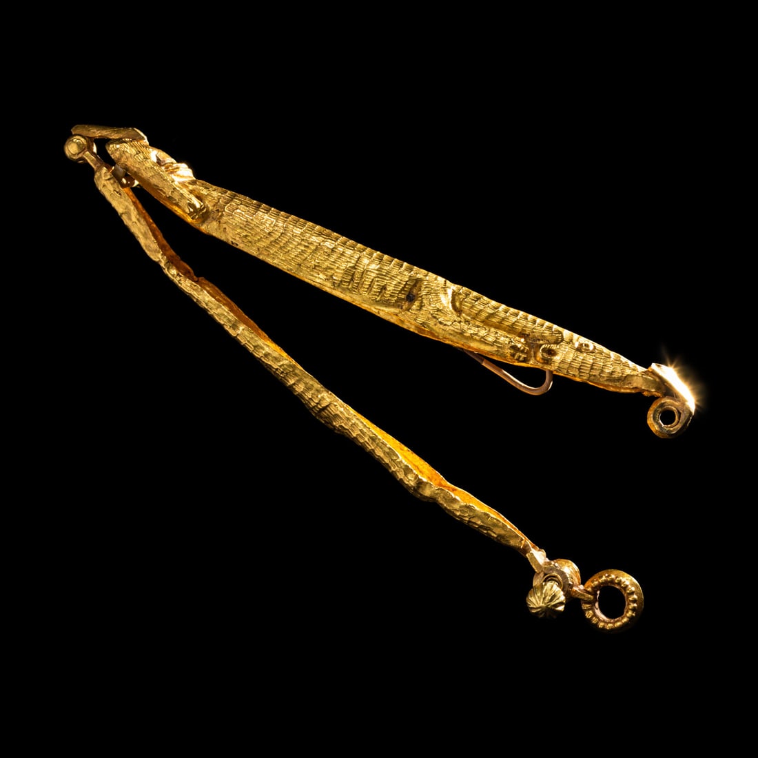 A Byzantine Gold Clasp Pendant: A Byzantine Gold Clasp Pendant Circa 11th Century A.D. Length 9.5 cm (3 3/4 inches); 25.1 grams. Provenance: J.J. Klejman, New York, 1960s. Christie's, London, Antiquities, 25 October 2012, Lot 142.