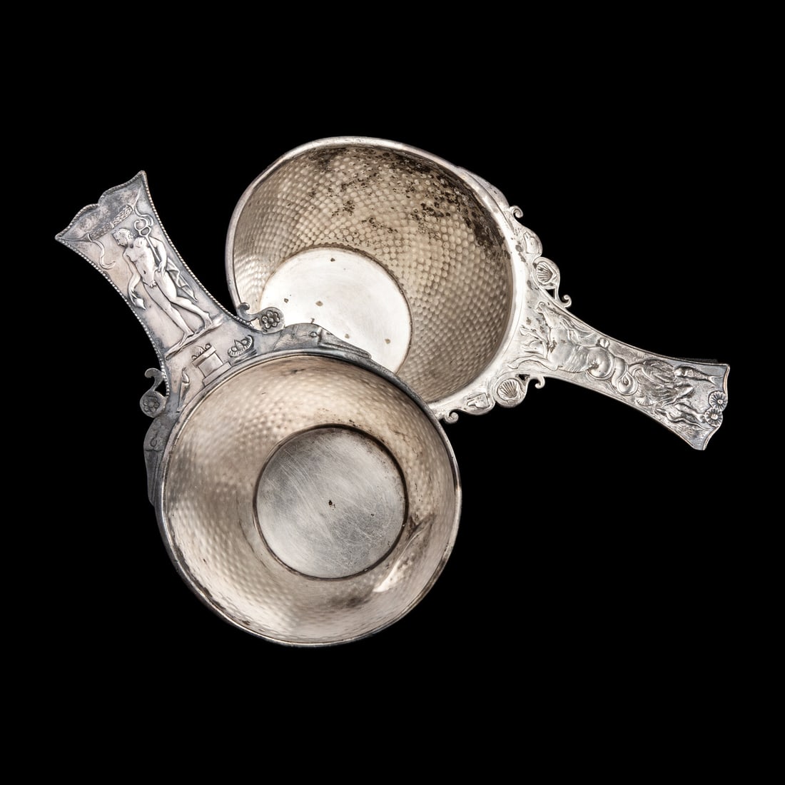 A Pair of Roman Silver Trullae: A Pair of Roman Silver Trullae Circa 1st Century A.D. Length of longest 23.5 cm (9 1/4 inches); 422.4 and 346.5 grams. Provenance: Art Market, Paris, late 1970s. Horst Merk Collection, Germany, 1981. 