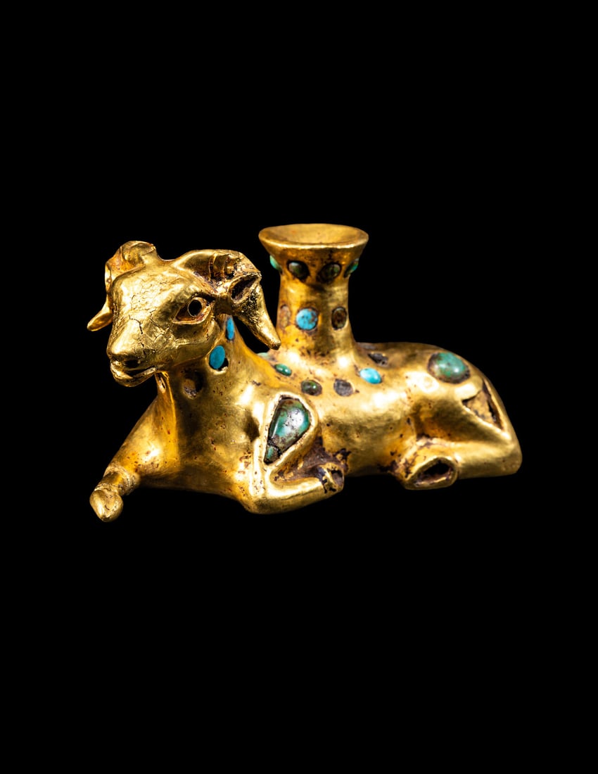 A Eurasian Gold and Turquoise Inlay Vessel in the form of a Recumbent Ram: A Eurasian Gold and Turquoise Inlay Vessel in the form of a Recumbent Ram Circa 5th-4th Century B.C. Length 8.5 cm (3 3/8 inches); 38.4 grams. Provenance: Private Collection, California, 1980s-1990s. 