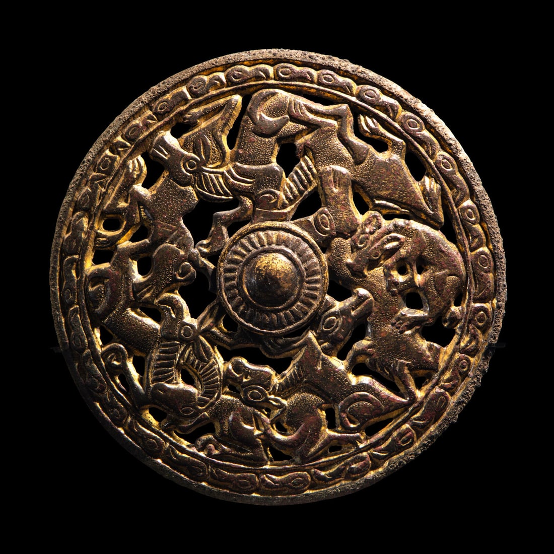 A Eurasian Gilt-Bronze Openwork Roundel: A Eurasian Gilt-Bronze Openwork Roundel Circa 5th Century B.C. Diameter 10 cm (4 inches); 126.3 grams. Provenance: Nasli M. Heeramaneck, New York, 1960s. Ariadne Galleries, New York, 1980s (Booklet I 