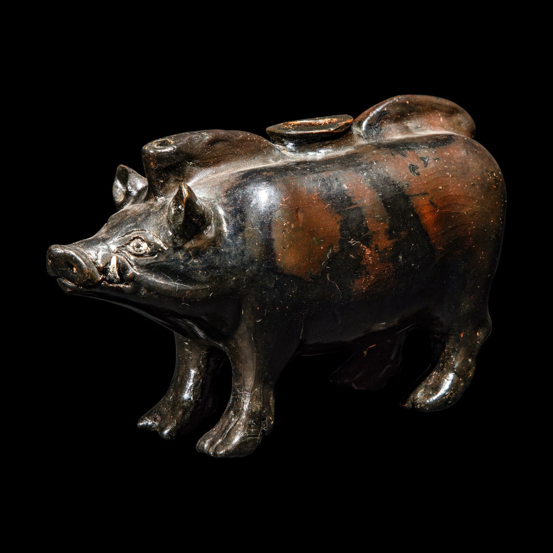 A South Italian Black-Glazed Askos in the form of a Boar: A South Italian Black-Glazed Askos in the form of a Boar Circa 4th Century B.C. Length 18.1 cm (7 1/8 inches). Provenance: Private Collection, Germany, acquired in the late 1980s-1990s. Galerie am Mus