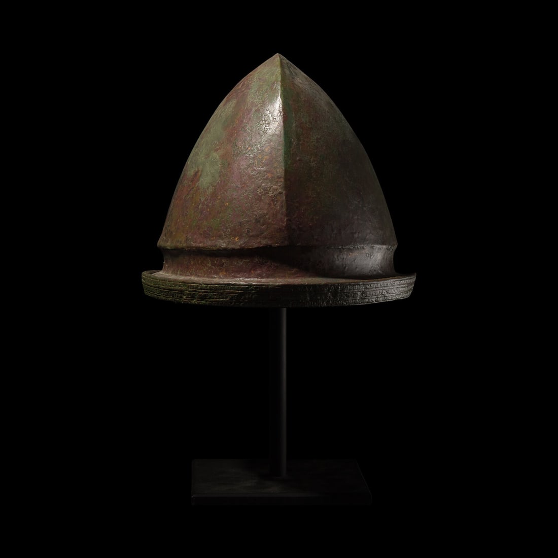 An Etruscan Bronze Helmet: An Etruscan Bronze Helmet Vetulonia Type, Circa 480-460 B.C. 25.4 cm (10 inches) x 23.5 cm (9 1/4 inches) x 21.6 cm (8 1/2 inches). Property from a New York Collection Provenance: Sotheby's, London, A
