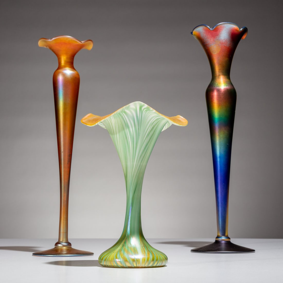 Quezal Early 20th Century Group of 3 Vases: Quezal Early 20th Century Group of 3 Vases favrile glass etched to undersides 12 h × 3¼ dia in | tallest Property from Bethany College This lot is located in Chicago.