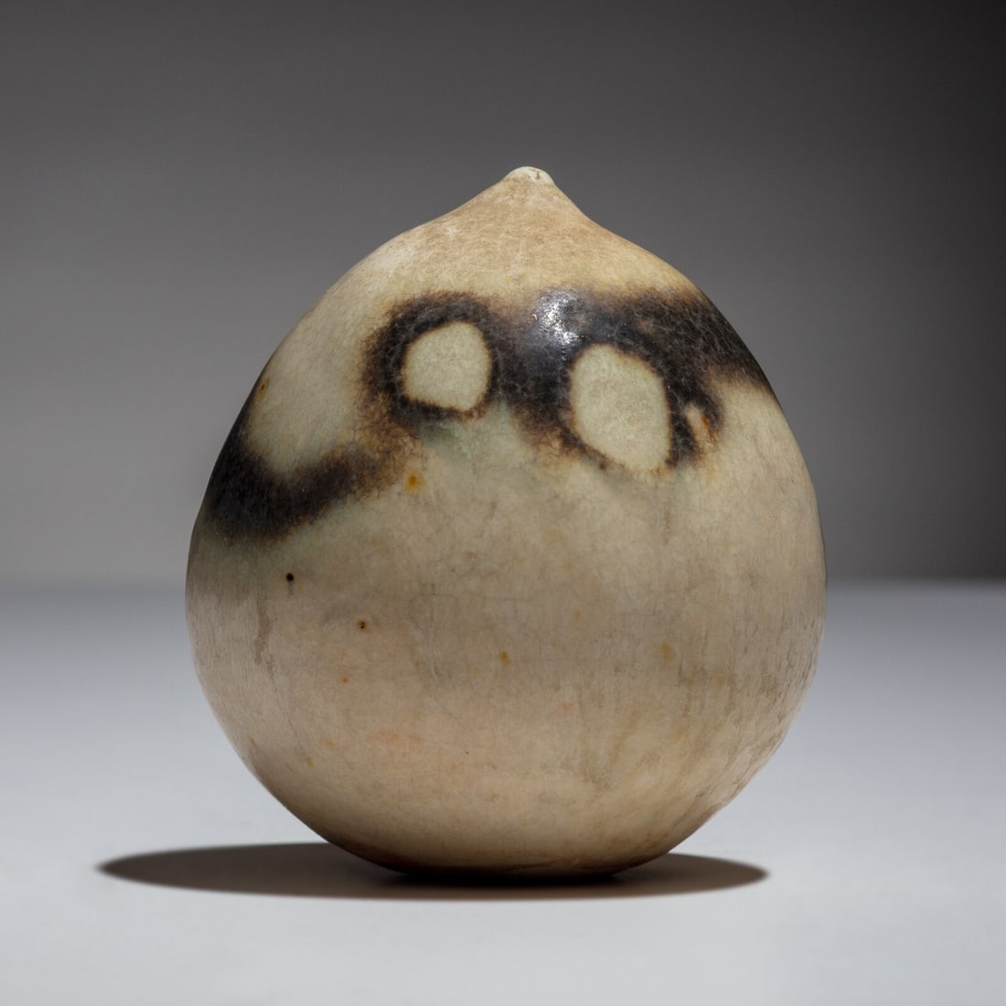 Toshiko Takaezu (American, 1922–2011) Closed Form with Rattle: Toshiko Takaezu (American, 1922–2011) Closed Form with Rattle possible glaze-obscured mark to underside glazed stoneware 2 ½ h × 3 dia in. This lot is located in Chicago. Provenance