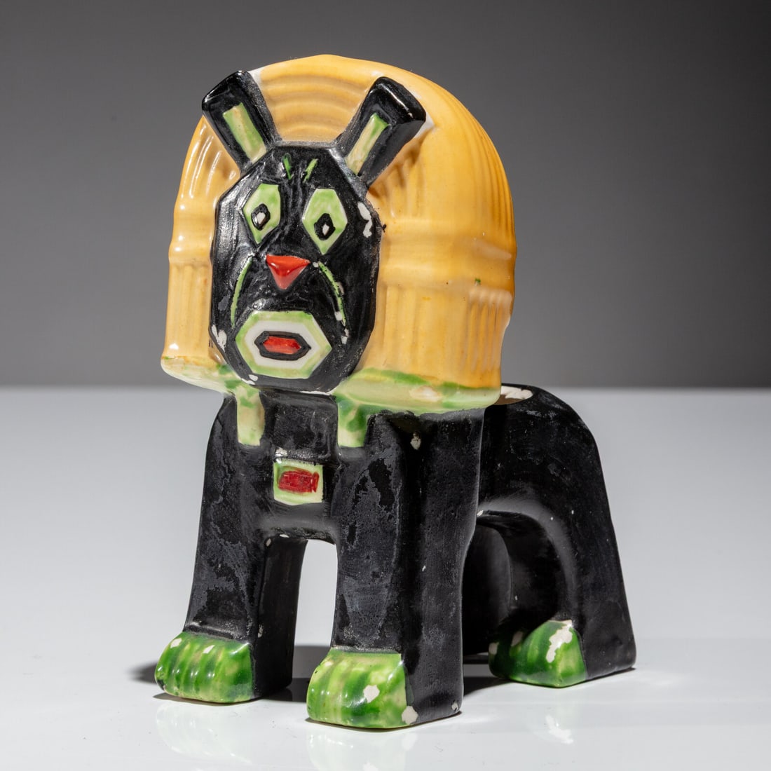 Louis Wain (English, 1860-1939) The Lion Cat: Louis Wain (English, 1860-1939) The Lion Cat signed 'Louis Wain' to back of leg, 'Rd No 638316' and cipher painted to underside with stamped mark 'Made in England' glazed porcelain 4 ¾ h × 2