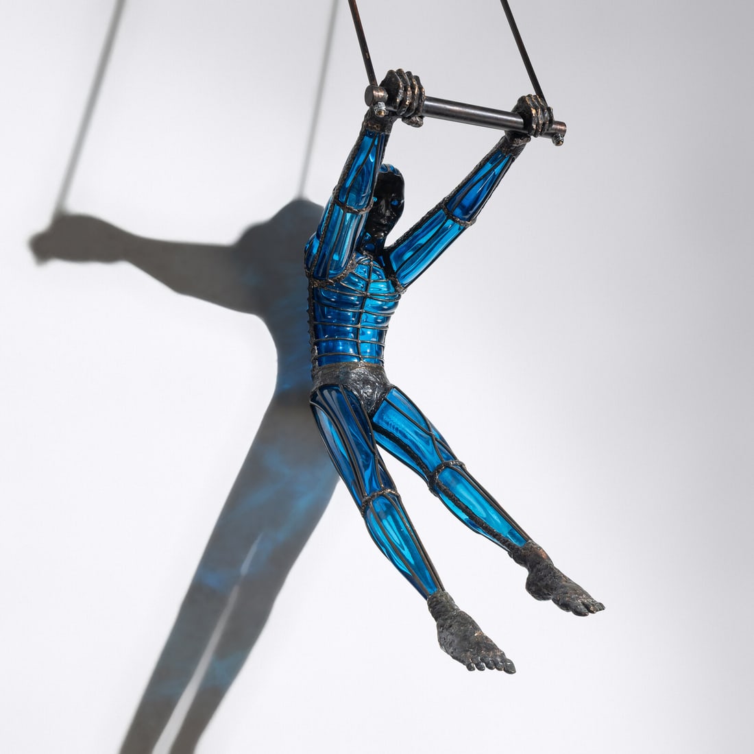 David Bennett (American, b. 1941) Acrobat Hanging Sculpture, c. 2005: David Bennett (American, b. 1941) Acrobat Hanging Sculpture, c. 2005 etched signature to arm 'David Bennett' hand-blown glass, patinated bronze 68 h × 12 ½ w × 27 d in. This lot is loca