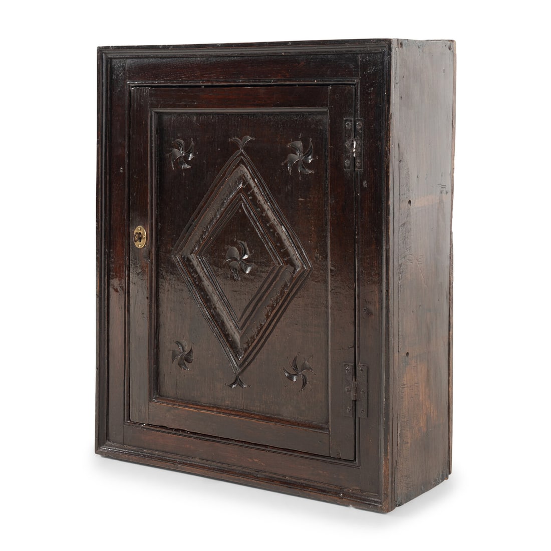 A Charles II Oak Hanging Cabinet: A Charles II Oak Hanging Cabinet Last Quarter 17th Century the door opening to an interior with two shelves. Height 28 x width 22 1/2 x depth 8 1/2 inches. Property from the Collection of Robert and