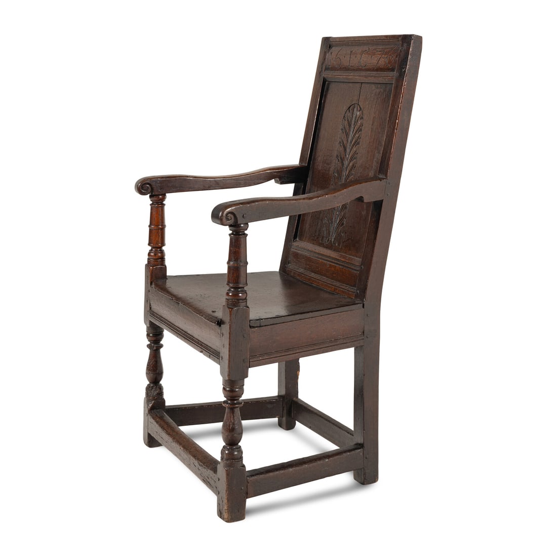 An English Oak Joined Armchair: An English Oak Joined Armchair Dated 1676 the crest rail engraved '16*IC*76'. Height 42 1/2 x width 24 1/4 x depth 21 1/2 inches. Property from the Collection of Robert and Roseann Drucker, Wilmette,