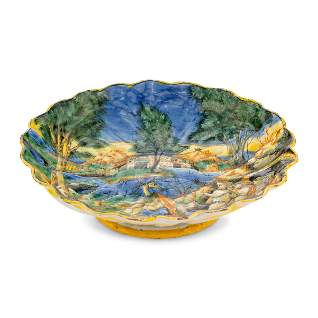 An Urbino Istoriato Majolica Scalloped Tazza: An Urbino Istoriato Majolica Scalloped Tazza 16th Century depicting the Metamorphosis of Actaeon, with Diana flanked by bathing nymphs to the right, inscribed Hateon to the underside in underglaze blu