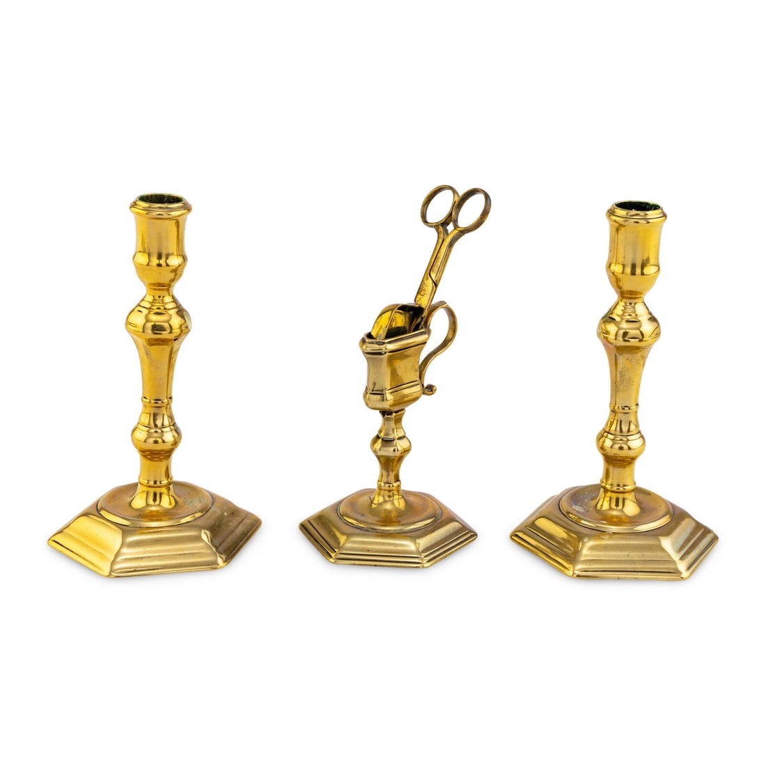 A Pair of English Brass Candlesticks with Wick-Shears and Stand: A Pair of English Brass Candlesticks with Wick-Shears and Stand 18th Century each having a stepped hexagonal base. Height of candlesticks 7 1/4 inches. Property from the Collection of Robert and
