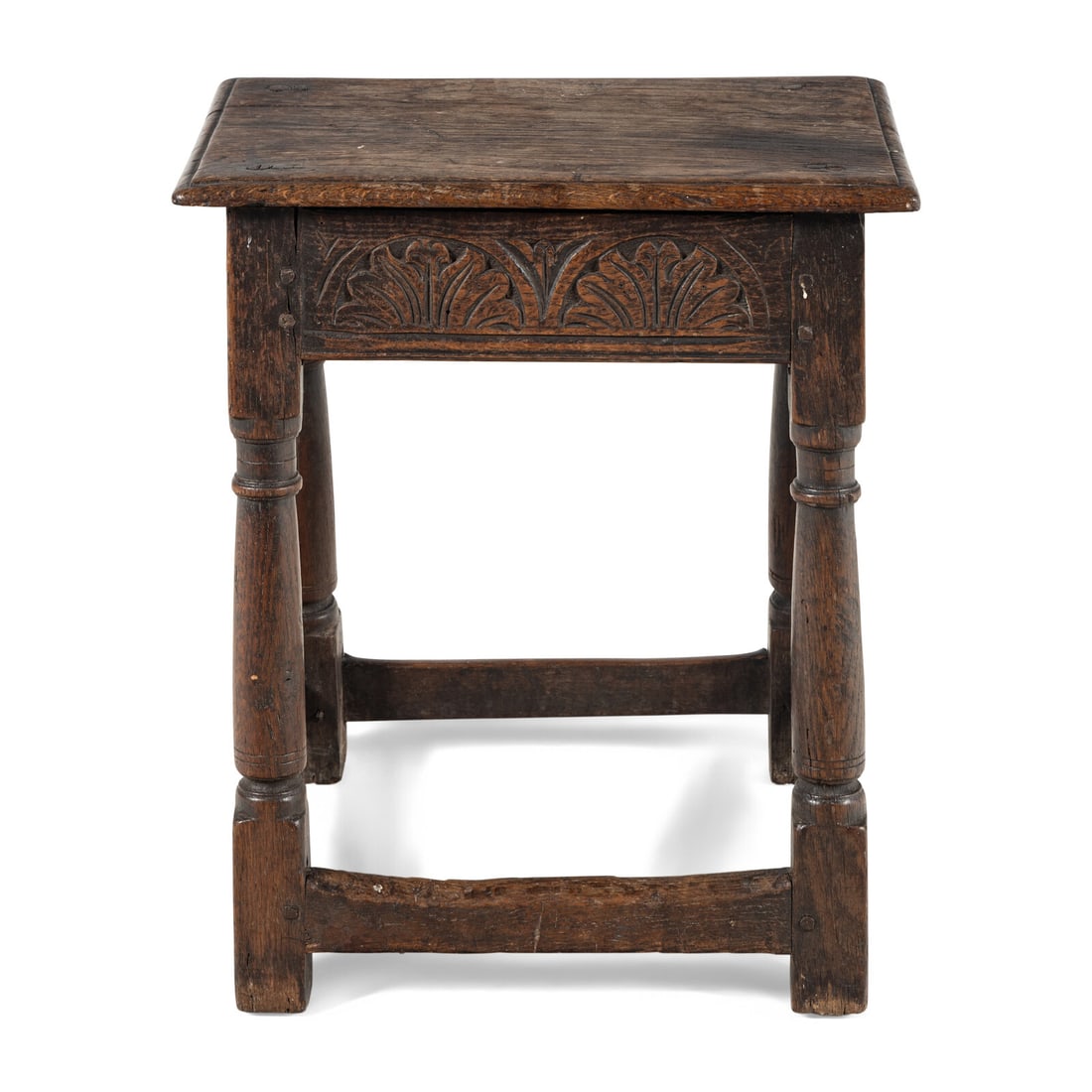 An English Oak Joined Stool: An English Oak Joined Stool Second Half 17th Century Height 20 x width 17 3/4 x depth 10 1/2 inches. Property from the Estate of Audrey and Philip Rietveld, Crete, Illinois This lot is located in