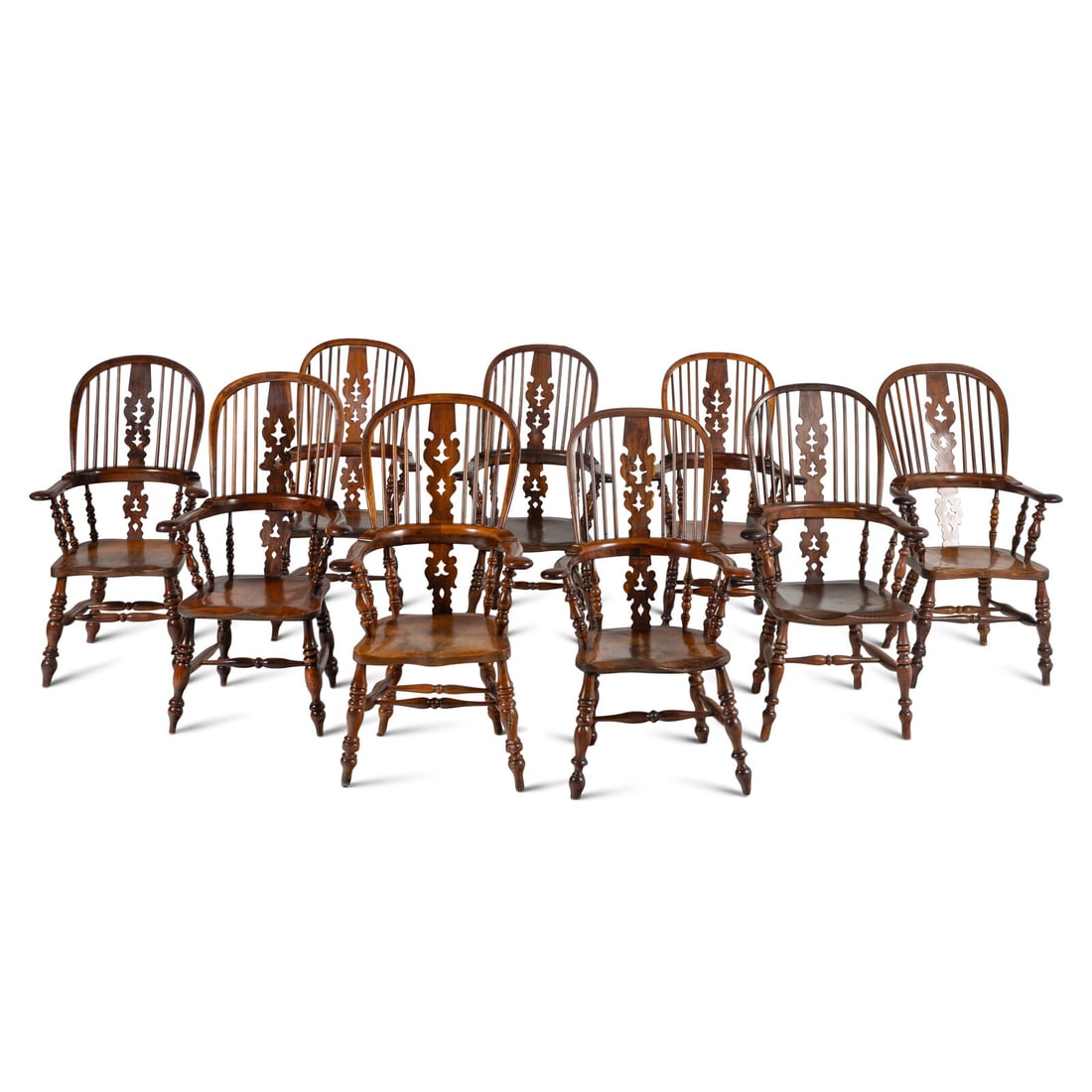 A Set of Eight English Yew and Elm Windsor Armchairs: A Set of Eight English Yew and Elm Windsor Armchairs 19th Century each with minor variation in size. Height of largest example 46 x width 25 x depth 23 inches. Property from the Estate of Audrey and